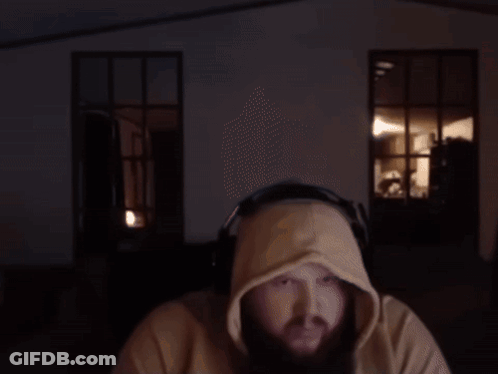 A Man Wearing Headphones And A Hooded Sweatshirt GIF