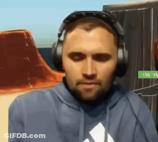 A Man Wearing Headphones And A Hoodie With An Adidas Logo On It GIF