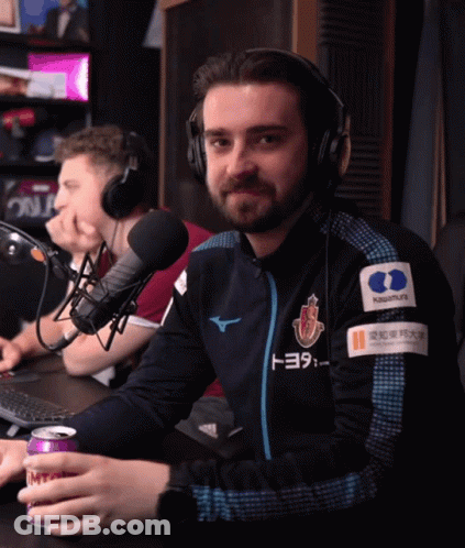 A Man Wearing Headphones And A Jacket That Has Toyota On It GIF