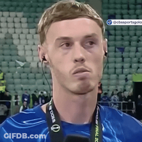 A Man Wearing Headphones And A Lanyard That Says World Cup GIF