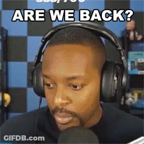 A Man Wearing Headphones And A Microphone Is Asking Are We Back GIF