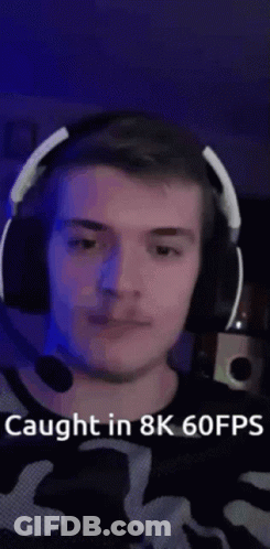 A Man Wearing Headphones And A Microphone Is Caught In 8K 60 Fps . GIF