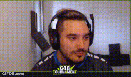 A Man Wearing Headphones And A Microphone Is Looking At The Camera . GIF