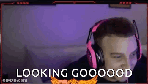A Man Wearing Headphones And A Microphone Is Looking At The Camera And Saying `` Looking Good '' . GIF