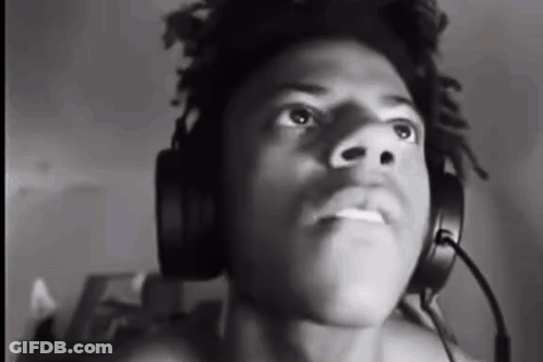 A Man Wearing Headphones And A Microphone Is Looking Up . GIF