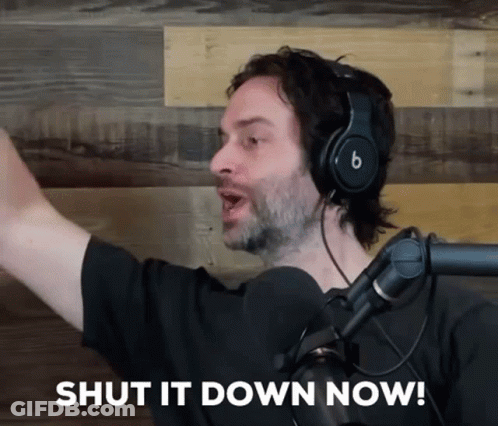 A Man Wearing Headphones And A Microphone Is Saying Shut It Down Now GIF