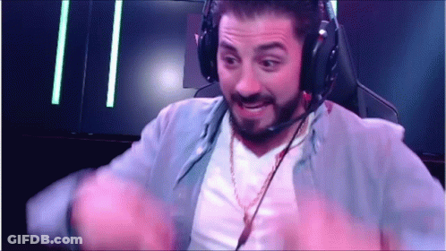 A Man Wearing Headphones And A Microphone Is Sitting In A Chair . GIF