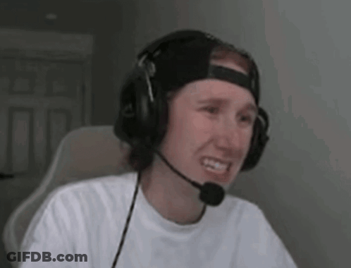 A Man Wearing Headphones And A Microphone Is Sitting In A Chair . GIF