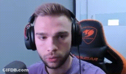A Man Wearing Headphones And A Microphone Is Sitting In A Gaming Chair . GIF