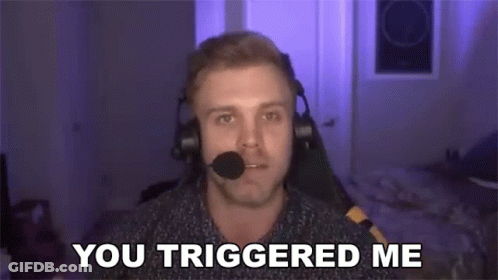 A Man Wearing Headphones And A Microphone Is Sitting In Front Of A Computer Screen . GIF