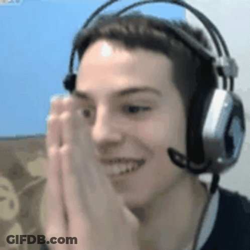 A Man Wearing Headphones And A Microphone Is Smiling And Making A Face . GIF