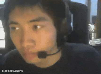 A Man Wearing Headphones And A Microphone Looks At The Camera . GIF
