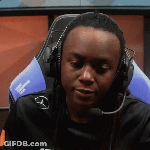A Man Wearing Headphones And A Microphone Looks Down At Something GIF