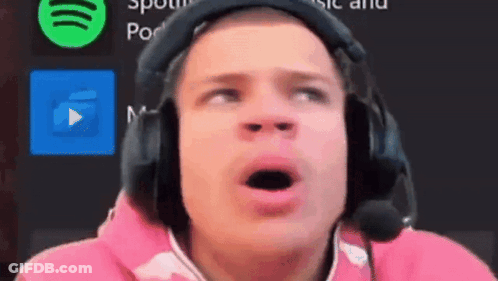 A Man Wearing Headphones And A Microphone Looks Surprised With His Mouth Open GIF