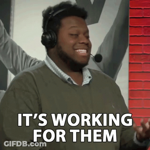 A Man Wearing Headphones And A Microphone Says It 'S Working For Them GIF