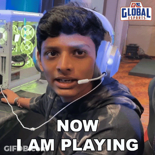 A Man Wearing Headphones And A Microphone Says Now I Am Playing GIF