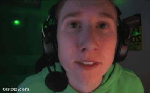 A Man Wearing Headphones And A Microphone Smiles GIF