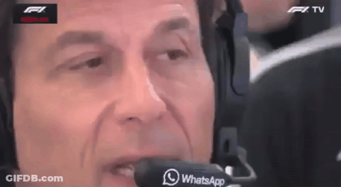 A Man Wearing Headphones And A Microphone With The Word Whatsapp On It GIF