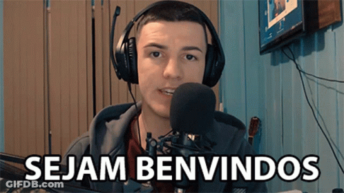 A Man Wearing Headphones And A Microphone With The Words Sejam Benvindos Below Him GIF