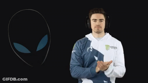 A Man Wearing Headphones And A Monster Energy Hoodie Applauds GIF