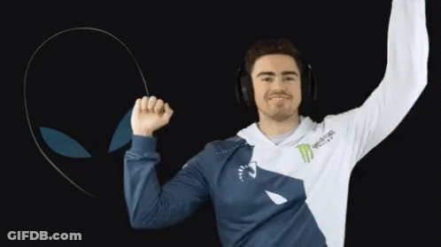 A Man Wearing Headphones And A Monster Energy Shirt Is Dancing GIF