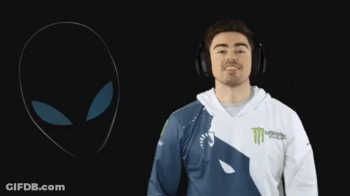 A Man Wearing Headphones And A Monster Shirt GIF