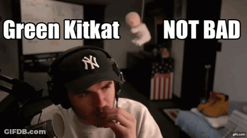 Man Wearing Headphones And Yankees Hat Says Green KitKat Not Bad GIF
