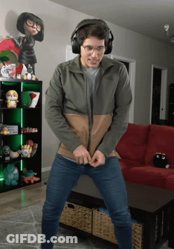 A Man Wearing Headphones And A North Face Jacket Is Dancing GIF