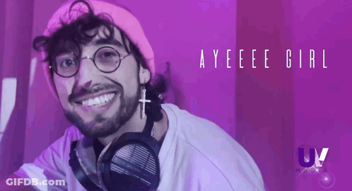 A Man Wearing Headphones And A Pink Hat Is Smiling In Front Of A Purple Background With The Words Ayeee Girl GIF