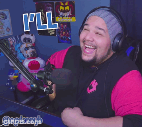 A Man Wearing Headphones And A Pink Shirt Says " I 'Ll Tell " GIF
