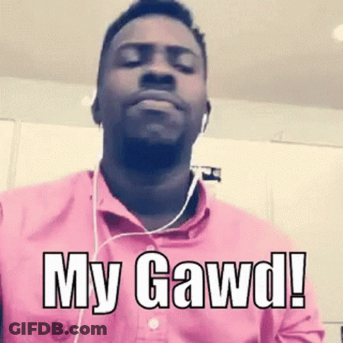 A Man Wearing Headphones And A Pink Shirt With The Words `` My Gawd '' Written On It . GIF