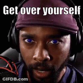 A Man Wearing Headphones And A Purple Hat Has The Words Get Over Yourself Written On His Face GIF