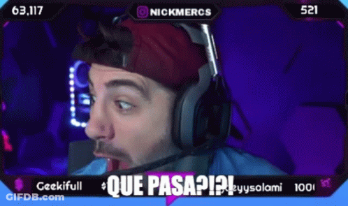 A Man Wearing Headphones And A Red Hat Says Que Pasa ? GIF
