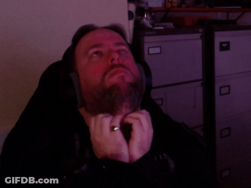 A Man Wearing Headphones And A Ring On His Finger GIF