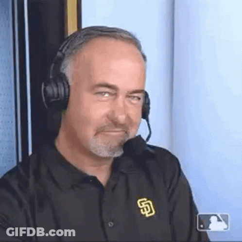 A Man Wearing Headphones And A San Diego Padres Shirt Is Making A Face . GIF