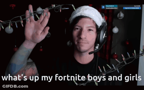 A Man Wearing Headphones And A Santa Hat With The Words What 'S Up My Fortnite Boys And Girls Below Him GIF