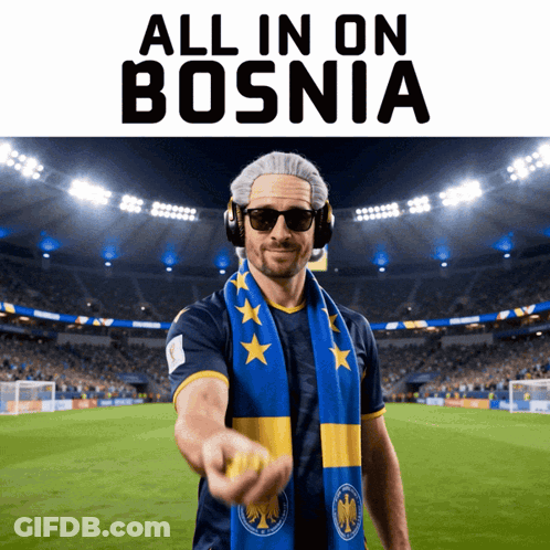 A Man Wearing Headphones And A Scarf Stands In Front Of A Soccer Field With The Words All In On Bosnia Above Him GIF