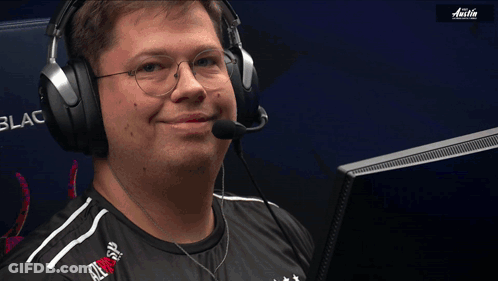 A Man Wearing Headphones And A Shirt That Says All Star Is Smiling GIF