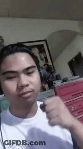 A Man Wearing Headphones And A Shirt That Says " Chicago Omaha " GIF
