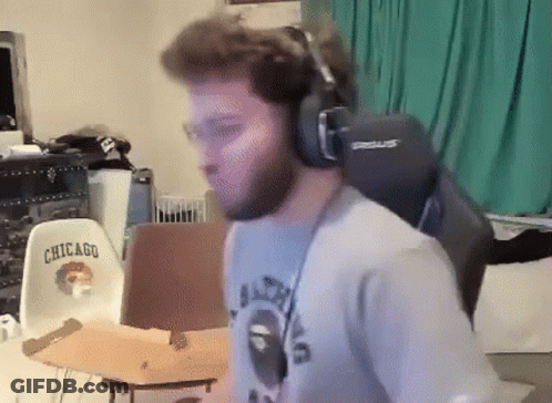 A Man Wearing Headphones And A Shirt That Says Chicago On It GIF