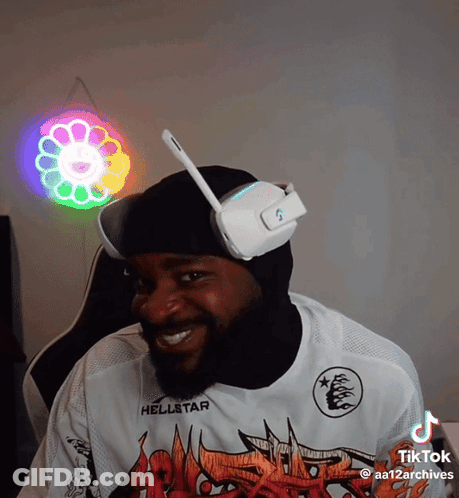 A Man Wearing Headphones And A Shirt That Says Hellstar On It GIF