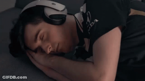 A Man Wearing Headphones And A Shirt That Says Honda Is Sleeping GIF