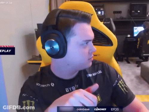 A Man Wearing Headphones And A Shirt That Says Monster On It GIF