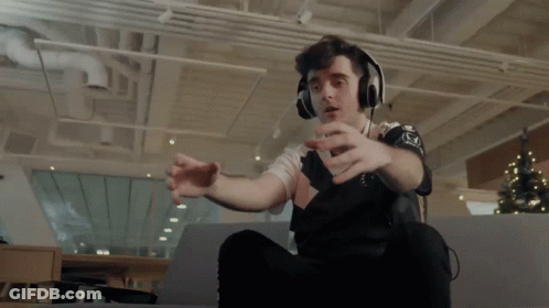 A Man Wearing Headphones And A Shirt That Says ' Nc ' On It GIF