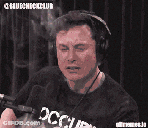 A Man Wearing Headphones And A Shirt That Says Occupied On It GIF