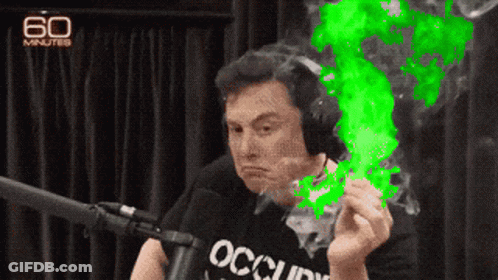 A Man Wearing Headphones And A Shirt That Says Occupy Is Smoking A Cigarette GIF