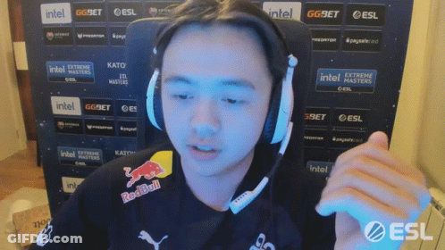 A Man Wearing Headphones And A Shirt That Says Redbull GIF
