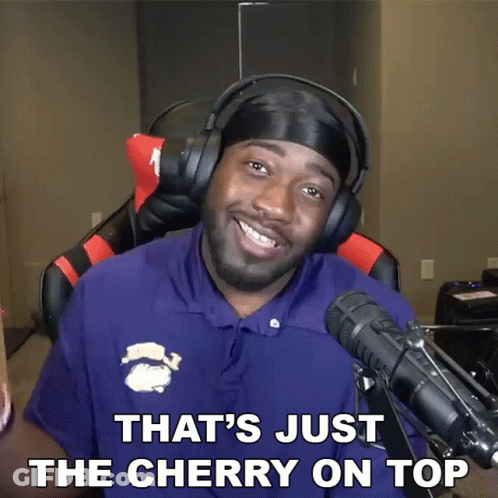 A Man Wearing Headphones And A Shirt That Says That 'S Just The Cherry On Top GIF