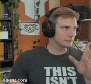 A Man Wearing Headphones And A Shirt That Says This Isn't GIF