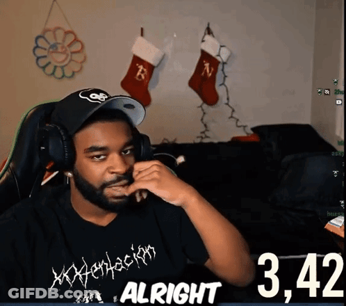 A Man Wearing Headphones And A Shirt That Says Xxxtentacion GIF